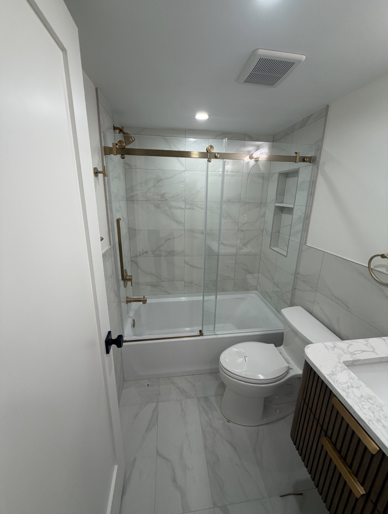 Tiled shower with glass door installation