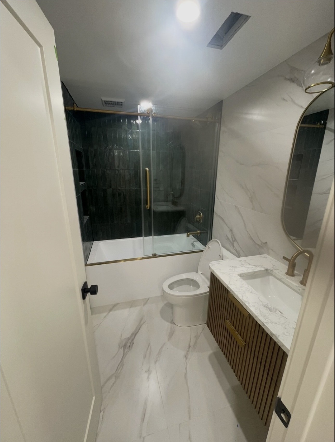 Completed bathroom tile and glass enclosure