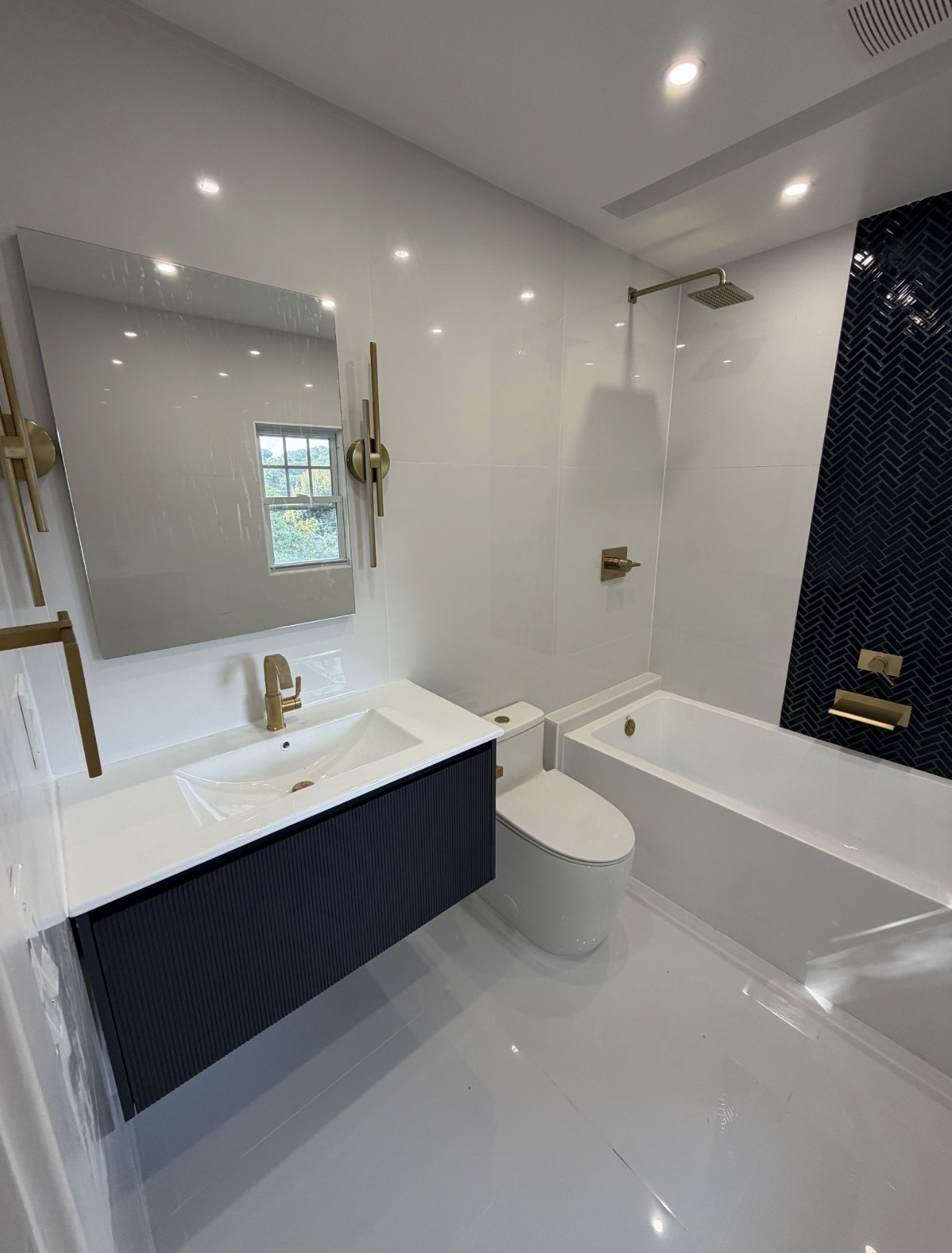 Master bathroom with tiled walls and floor