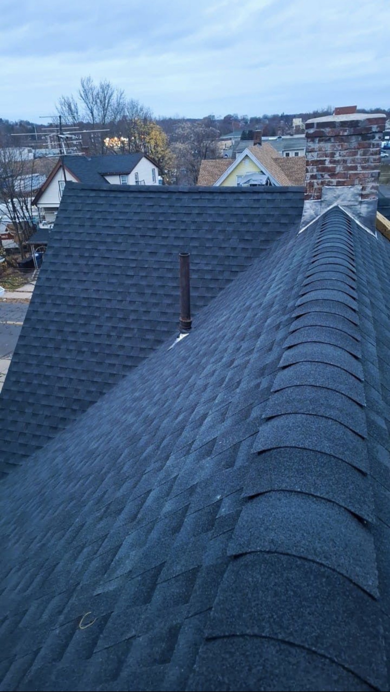 Finished dark architectural shingles with hip and ridge cap