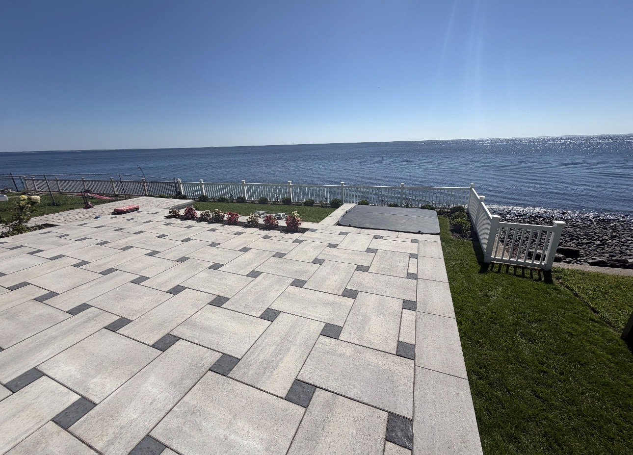 Waterfront patio with patterned stone pavers