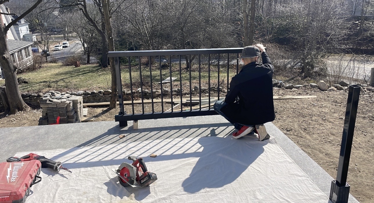 Railing being fitted on a new Trex deck
